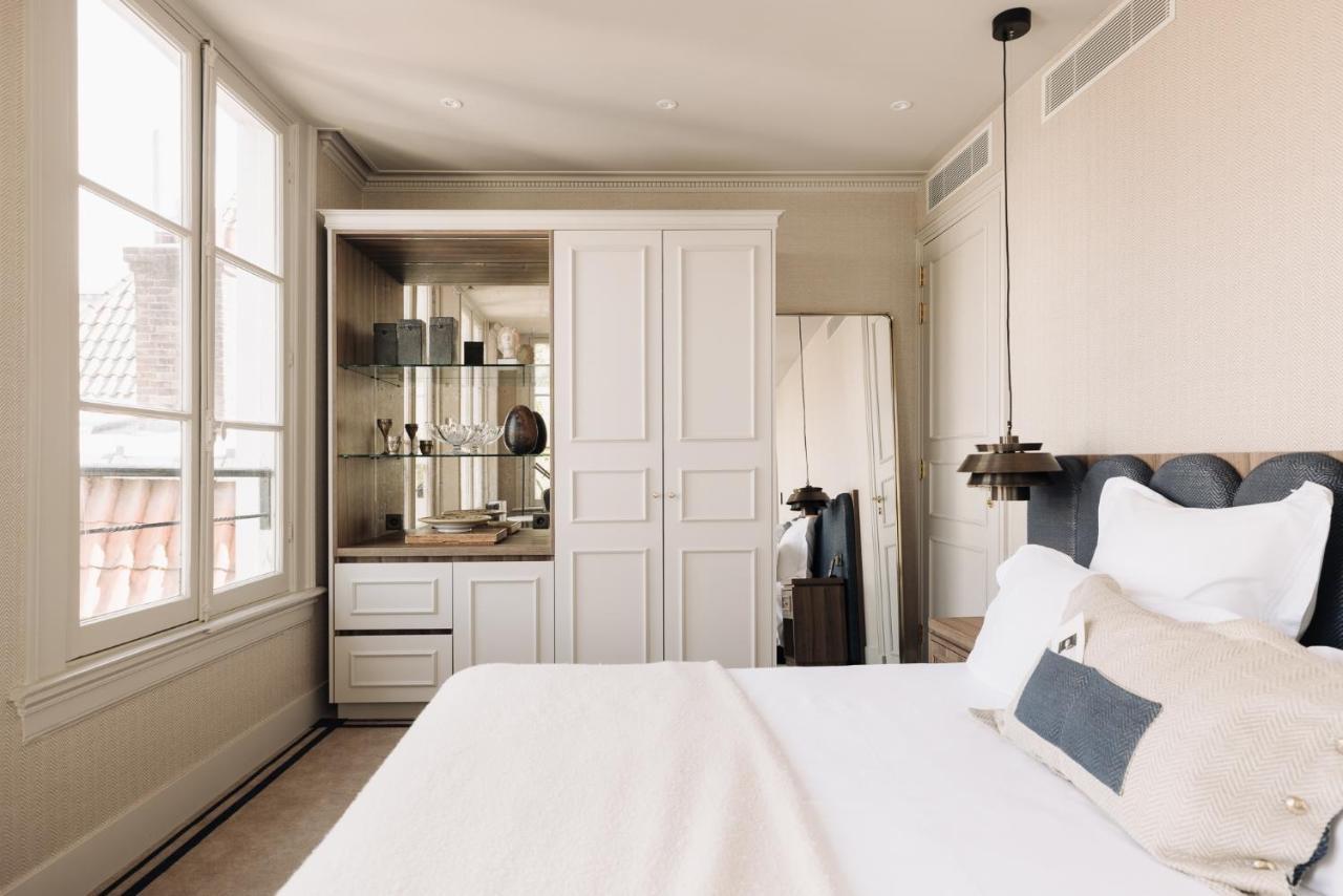 Hotel 717 Amsterdam Exteriér fotografie A bedroom at the Hotel de la Paix